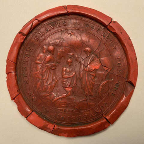 Red wax seal with figures and lettering